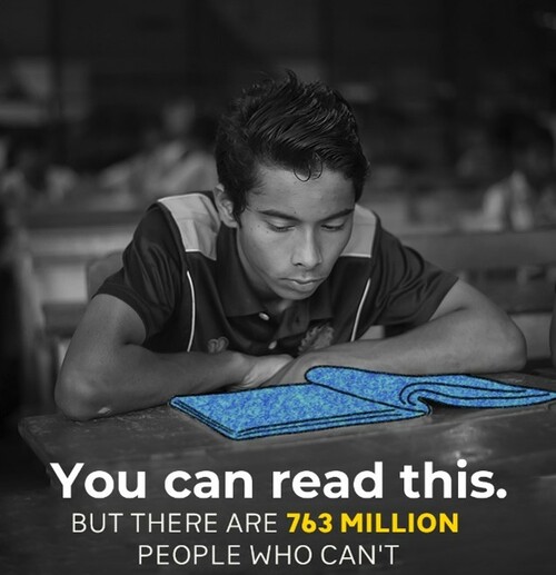 A black and white photo with a young man looking at a book.  Caption says "You can read this but there are 763 million people who can't"